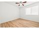 A clean bedroom with wood floor, ceiling fan and bright window at 5112 Foggia Ave, Las Vegas, NV 89130