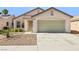 Charming single-story home featuring a two-car garage, low maintenance desert landscaping and neutral color palette at 5112 Foggia Ave, Las Vegas, NV 89130