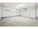 Spacious two car garage with a large white door, and ample room for vehicles and storage at 5112 Foggia Ave, Las Vegas, NV 89130