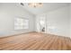 Large main bedroom featuring wood-look flooring and natural light at 5112 Foggia Ave, Las Vegas, NV 89130