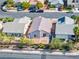 Aerial view of a single-story home featuring a low maintenance backyard with mature desert landscaping at 5112 Foggia Ave, Las Vegas, NV 89130