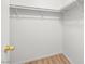 A Walk-in closet with shelving and wood flooring at 5112 Foggia Ave, Las Vegas, NV 89130