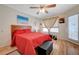 Comfortable bedroom with ceiling fan, wood-look floors, and lots of natural light at 5196 Mandalay Springs Dr # 101, Las Vegas, NV 89120