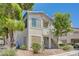 Two story condo featuring a stucco facade, with a small yard and desert landscaping at 5196 Mandalay Springs Dr # 101, Las Vegas, NV 89120