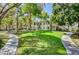 Well-maintained two-story exterior featuring beautiful landscaping and inviting walkways at 5196 Mandalay Springs Dr # 101, Las Vegas, NV 89120