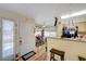 Kitchen with breakfast bar, granite countertops, and hardwood floors, and an open floor plan at 5196 Mandalay Springs Dr # 101, Las Vegas, NV 89120