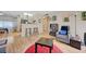 Living room flowing into kitchen with breakfast bar, hardwood floors, and open concept at 5196 Mandalay Springs Dr # 101, Las Vegas, NV 89120