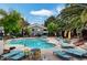 Sparkling community pool with lounge chairs, a perfect spot for relaxation and socializing at 5196 Mandalay Springs Dr # 101, Las Vegas, NV 89120