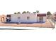 A quaint single-story home with minimal landscaping in the front yard, stucco walls, and a chainlink fence at 5305 W Cheyenne Ave, Las Vegas, NV 89108