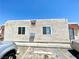 Small apartment complex featuring multiple mailboxes and parking spaces in front with a neutral stucco finish at 5305 W Cheyenne Ave, Las Vegas, NV 89108