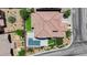 This is an aerial view showing a detailed roof, landscaping, backyard pool, and proximity to neighboring houses at 5542 Oak Bend Dr, Las Vegas, NV 89135