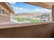 Open balcony view with desert landscape, neighborhood homes, and blue sky in the background at 5542 Oak Bend Dr, Las Vegas, NV 89135