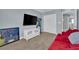Bedroom with a red sofa and a TV at 5542 Oak Bend Dr, Las Vegas, NV 89135