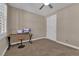 Bedroom featuring a ceiling fan, desk and closet with sliding doors at 5542 Oak Bend Dr, Las Vegas, NV 89135