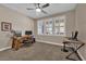 Neutral bedroom with ceiling fan and window shutters at 5542 Oak Bend Dr, Las Vegas, NV 89135