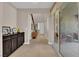 Bright entryway featuring tile floors, storage cabinets, and a glimpse of the staircase leading to the upper level at 5542 Oak Bend Dr, Las Vegas, NV 89135