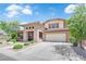 Attractive two-story home featuring a stone facade, desert landscaping and a spacious two-car garage at 5542 Oak Bend Dr, Las Vegas, NV 89135
