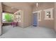 Inviting covered front porch with a charming bench, providing a welcoming entrance to the home at 5542 Oak Bend Dr, Las Vegas, NV 89135