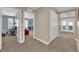 Hallway with multiple rooms, doors, and natural light from the windows at 5542 Oak Bend Dr, Las Vegas, NV 89135