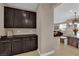 Open living area with dark cabinets and lots of space at 5542 Oak Bend Dr, Las Vegas, NV 89135