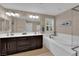 Dual sink bathroom with separate shower and tub at 5542 Oak Bend Dr, Las Vegas, NV 89135