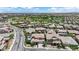 This is an aerial view of a suburban neighborhood with well-maintained homes, landscaping, and community amenities like a park or baseball field at 5542 Oak Bend Dr, Las Vegas, NV 89135