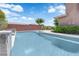 The inviting pool showcases elegant water features, complementing the desert landscaping, and creating a tranquil outdoor space at 5542 Oak Bend Dr, Las Vegas, NV 89135