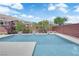 Modern swimming pool with water features and an enclosed backyard, perfect for relaxation at 5542 Oak Bend Dr, Las Vegas, NV 89135