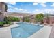 Backyard pool features modern design with integrated fountains and desert views at 5542 Oak Bend Dr, Las Vegas, NV 89135