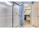 Cozy bathroom featuring a shower, double sinks and a walk-in closet at 6058 Grape Blossom Ave, Las Vegas, NV 89142