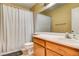 Functional bathroom featuring a shower with curtain, vanity with sink, and a toilet at 6058 Grape Blossom Ave, Las Vegas, NV 89142