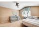 Bedroom features a crib and sleeping space with a stylish ceiling fan and natural light at 6058 Grape Blossom Ave, Las Vegas, NV 89142