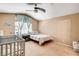 Bedroom featuring a crib, single bed, ceiling fan, and carpeted floor at 6058 Grape Blossom Ave, Las Vegas, NV 89142
