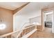 Upper hallway with a staircase and a view into a bedroom with a crib at 6058 Grape Blossom Ave, Las Vegas, NV 89142