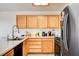Modern kitchen with wood cabinets, stainless steel appliances, and plenty of counter space at 6058 Grape Blossom Ave, Las Vegas, NV 89142