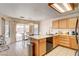 Cozy eat-in kitchen with tile floors, wood cabinets and a sliding door to the backyard at 6058 Grape Blossom Ave, Las Vegas, NV 89142