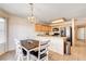Bright eat-in kitchen boasts wood cabinets, breakfast bar, and lots of counter space at 6058 Grape Blossom Ave, Las Vegas, NV 89142