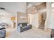 Spacious living room adjacent to the kitchen with an open floor plan at 6058 Grape Blossom Ave, Las Vegas, NV 89142