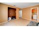 Inviting living room with tile floors, neutral tones, and a convenient laundry area at 6058 Grape Blossom Ave, Las Vegas, NV 89142