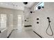 Glass shower with multiple shower heads and a black bench at 6075 Dapple Gray Rd, Las Vegas, NV 89149
