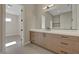 Vanity area with a marble countertop and sleek cabinets at 6075 Dapple Gray Rd, Las Vegas, NV 89149