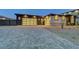 Paver driveway leading to a modern home with two-car garages at 6075 Dapple Gray Rd, Las Vegas, NV 89149
