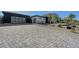 Long, paved driveway leading to a modern single-story home with desert landscaping at 6075 Dapple Gray Rd, Las Vegas, NV 89149