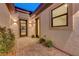 Inviting courtyard with pavers leading to the home's entrance at 6075 Dapple Gray Rd, Las Vegas, NV 89149