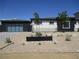 Contemporary home showcasing a minimalist landscape design with desert plants and modern architectural elements at 6075 Dapple Gray Rd, Las Vegas, NV 89149