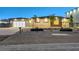 Contemporary home featuring a modern design, garage, and desert landscaping at 6075 Dapple Gray Rd, Las Vegas, NV 89149