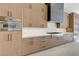 Close up of kitchen with stainless oven, gas range, and wooden cabinets and drawers at 6075 Dapple Gray Rd, Las Vegas, NV 89149