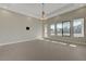 Spacious living room with recessed lighting, modern light and outside access at 6075 Dapple Gray Rd, Las Vegas, NV 89149