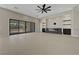 Open living room with fireplace and large sliding doors to backyard patio, open floor plan at 6075 Dapple Gray Rd, Las Vegas, NV 89149