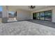 Spacious covered patio features seamless transition to a large paver patio overlooking backyard space at 6075 Dapple Gray Rd, Las Vegas, NV 89149